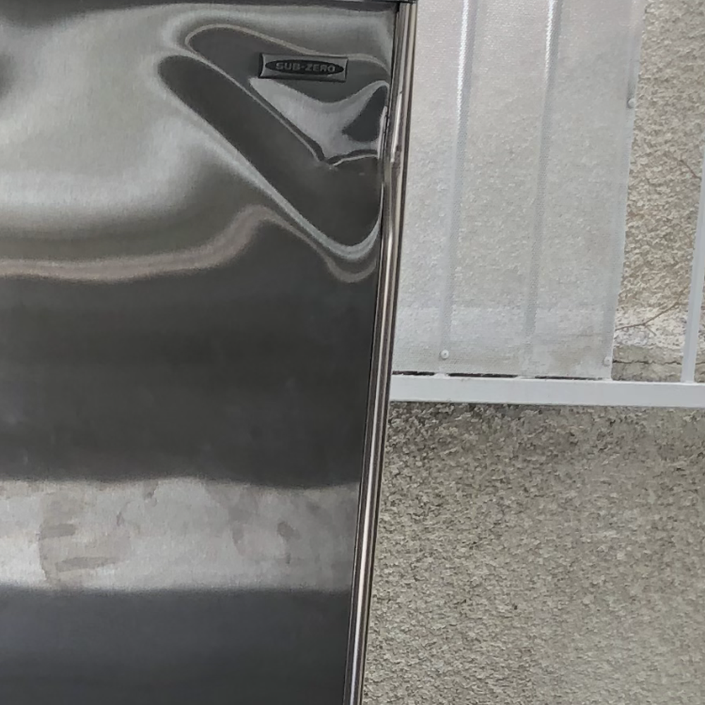 Lugg - Dented subzero fridge - rendered useless - Movers Near Me Lugg - Dented subzero fridge - rendered useless - Movers Near Me