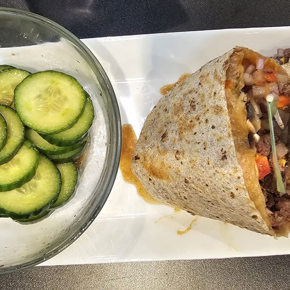 PROTEINHOUSE - Bison cheesesteak wrap and cucumber salad - Juice Bars & Smoothies Near Me - Modesto, California PROTEINHOUSE - Bison cheesesteak wrap and cucumber salad - Juice Bars & Smoothies Near Me - Modesto, California