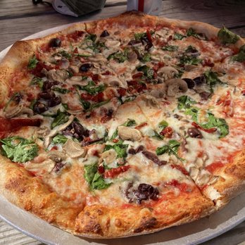 Pizzoco Pizza Parlor - Kalamata olives, mushrooms, spinach, and sun-dried tomatoes.  And that crust!!! Incredible. - Pizza Near Me - Winchester, Virginia