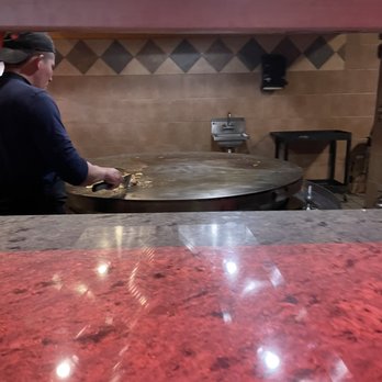 Mongolian Grill & Buffet - a man preparing food - Chinese Near Me - Norfolk, Nebraska