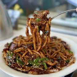 Tarim Garden - Stir-Fried Noodles 干煸炒面: Udon, beef, onion, dried chili, chives, ginger, garlic, sesame ($21.95)
