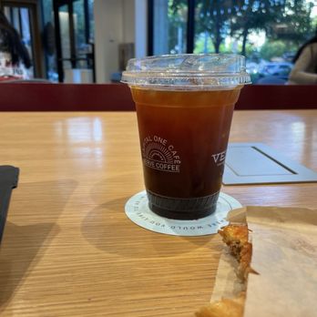 Capital One Café - An iced americano with a round puff pastry. - Coffee & Tea Near Me - Dallas, Texas Capital One Café - An iced americano with a round puff pastry. - Coffee & Tea Near Me - Dallas, Texas