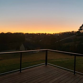 OS Fabrication and Design - Sunset on the open end of the deck with cable railing system. - Metal Fabricators Near Me OS Fabrication and Design - Sunset on the open end of the deck with cable railing system. - Metal Fabricators Near Me
