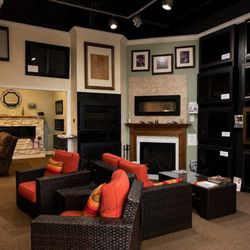 Fireplace showroom, filled with screens, doors, inserts, log sets & more all on display! real working models so you can see them burn!