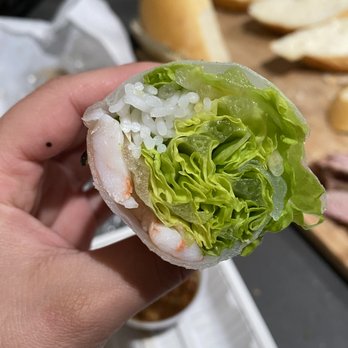 Saigon City - a hand holding a lettuce wrapped in lettuce - Vietnamese Near Me - San Mateo, California Saigon City - a hand holding a lettuce wrapped in lettuce - Vietnamese Near Me - San Mateo, California