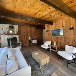 a living room with wood paneling a living room with wood paneling