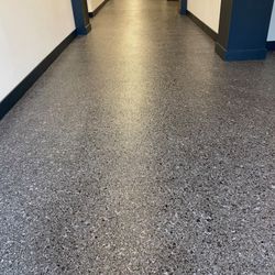 Garage Experts - A warehouse in the local area epoxied their floors and it makes it look inviting!