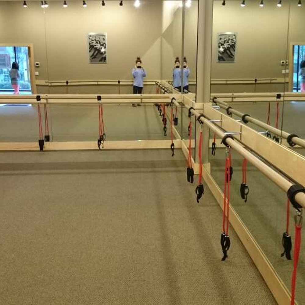 Pure Barre - Hanging rubber band tubes add much more resistance at the bar - Pilates Near Me - Seattle, Washington Pure Barre - Hanging rubber band tubes add much more resistance at the bar - Pilates Near Me - Seattle, Washington