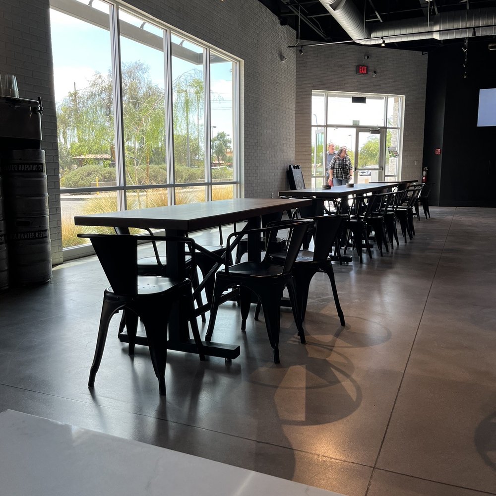 Goldwater Brewing - tables and chairs in a large room - Breweries Near Me - Tempe, Arizona Goldwater Brewing - tables and chairs in a large room - Breweries Near Me - Tempe, Arizona