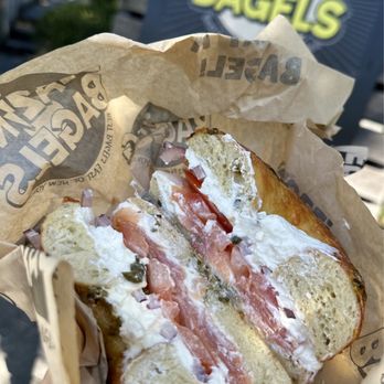 Blazing Bagels - a half eaten sandwich in a paper bag - Bagels Near Me - Bellevue, Washington