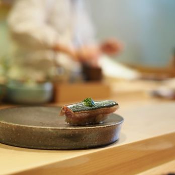 Sushi Yoshizumi - a person in the background - Sushi Bars Near Me - San Mateo, California Sushi Yoshizumi - a person in the background - Sushi Bars Near Me - San Mateo, California