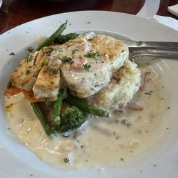 Pan fried halibut over potato cake and sautéed fresh veggies Pan fried halibut over potato cake and sautéed fresh veggies