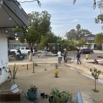 Creative Turf Install - Wetting down the decomposed granite - Landscaping Near Me