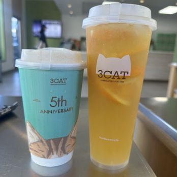 3CAT Handcrafted Beverage - Jasmine Tea Latte (left) Orange Jasmine Tea Lemonade (Right) - Not exact names - Bubble Tea Near Me - Los Angeles, California 3CAT Handcrafted Beverage - Jasmine Tea Latte (left) Orange Jasmine Tea Lemonade (Right) - Not exact names - Bubble Tea Near Me - Los Angeles, California