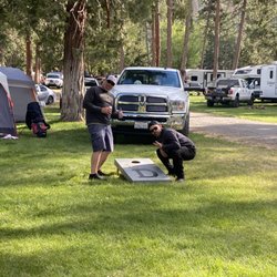 Hat Creek Hereford Ranch RV Park & Campground - Campsites full of lush green grass... perfect for cornhole!