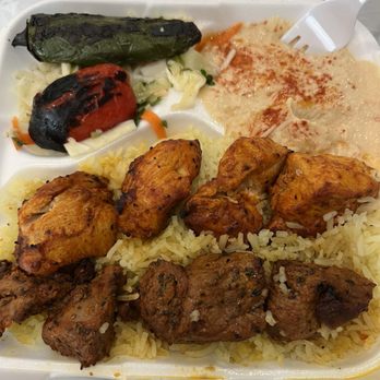 Olives Mediterranean Café - kebab with chicken and beef. Served with rice, hummus, small salad and grilled tomato and grilled jalapeño - Mediterranean Near Me - Lancaster, California Olives Mediterranean Café - kebab with chicken and beef. Served with rice, hummus, small salad and grilled tomato and grilled jalapeño - Mediterranean Near Me - Lancaster, California