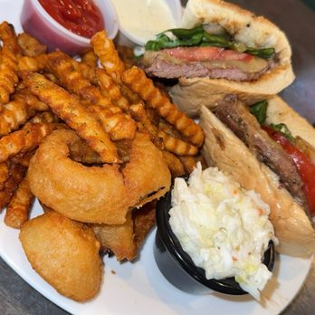 Legends Corner - Ribeye sandwich with fries and slaw - American Near Me - Monticello, Illinois Legends Corner - Ribeye sandwich with fries and slaw - American Near Me - Monticello, Illinois