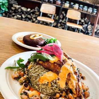 Vic & Al's - Blackened Catfish with Morita Chili Rub over Sassafras Rice and Fried Boudin in the back. - Cajun/Creole Near Me - Austin, Texas Vic & Al's - Blackened Catfish with Morita Chili Rub over Sassafras Rice and Fried Boudin in the back. - Cajun/Creole Near Me - Austin, Texas