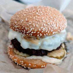 Fancy DH Toasted Sesame Bun, DH 10oz Dry Aged Patty, Provolone Cheese, Caramelized Onions, Pickles, Garlic Aioli