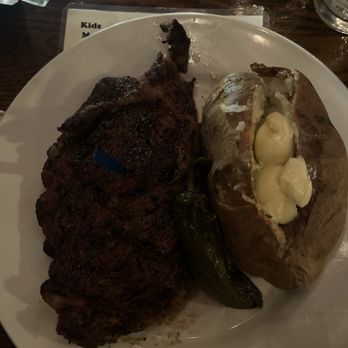 The Flame Steakhouse - Ribeye, baked potato - Steakhouses Near Me - Fort Morgan, Colorado The Flame Steakhouse - Ribeye, baked potato - Steakhouses Near Me - Fort Morgan, Colorado