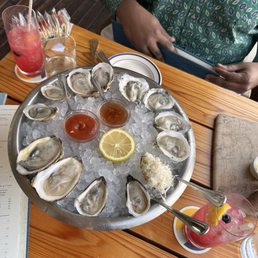 Variety of oysters and blueberry lemonade Variety of oysters and blueberry lemonade