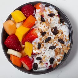 Paleteria El Paraiso - Biónico: chopped fruits with shredded coconut flakes, raisins, and granola.