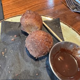 Doughnut holes. Cinnamon sugar coated. Nutella sauce. Doughnut holes. Cinnamon sugar coated. Nutella sauce.