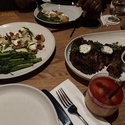 Tomahawk steak with broccolini and crispy mashed potatoes. Tomahawk steak with broccolini and crispy mashed potatoes.