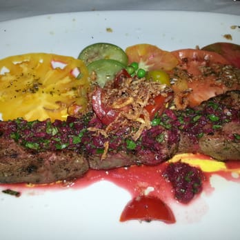 Carnivale Chicago - steak with special sauce and variety of tomatoe - my favorite - Latin American Near Me - Chicago, Illinois