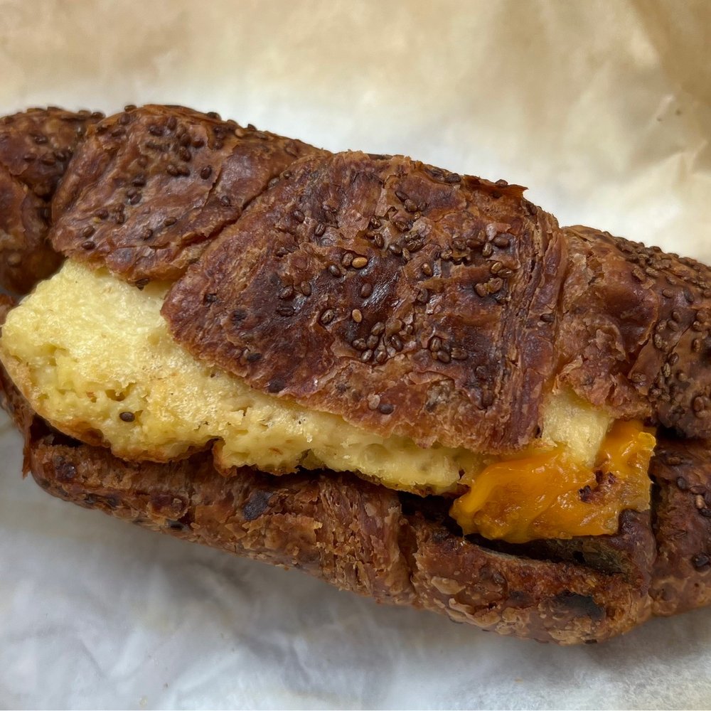 Gregorys Coffee - Vegan Deluxe - vegan sausage, folded with JUST Egg™, vegan cheddar, and stacked in vegan chia seed croissant - Coffee & Tea Near Me - Summit, New Jersey