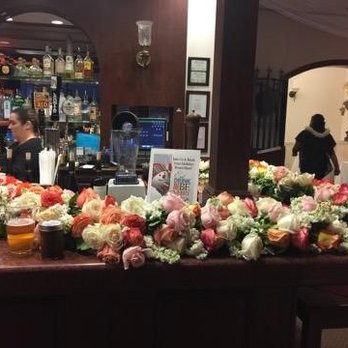 Sal The Flower Guy - So much garland they used it to decorate the bar for the reception after the ceremony - Florists Near Me - Napa, California Sal The Flower Guy - So much garland they used it to decorate the bar for the reception after the ceremony - Florists Near Me - Napa, California
