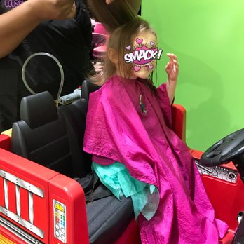 Sharkey's Cuts for Kids - Mid-cut in the fire truck. - Kids Hair Salons Near Me - Cary, North Carolina Sharkey's Cuts for Kids - Mid-cut in the fire truck. - Kids Hair Salons Near Me - Cary, North Carolina