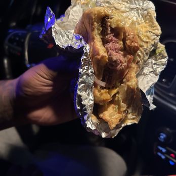 Arby’s - a person holding a sandwich in a car - Sandwiches Near Me - Indio, California