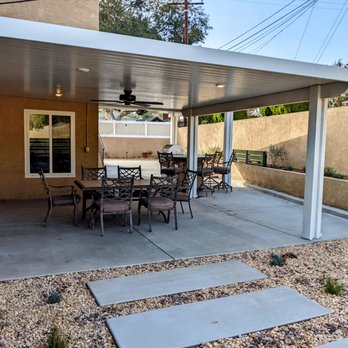 All Environmental Design - Backyard after. New patio covers, new concrete, new BBQ island. Dead grass replaced with rock and plants. Planters have plants and mulch. - Landscaping Near Me - Pomona, California