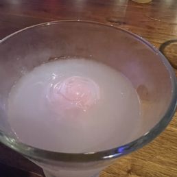 Lychee martini cocktail with ice shaped like a rose. Lychee martini cocktail with ice shaped like a rose.