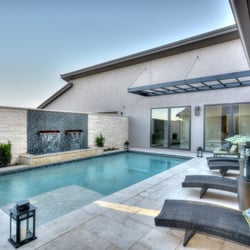 Master Pools of Austin - Your own oasis in your courtyard! #custompoolbuildersaustin #austincustompoolbuilder #couryardpoolaustin #travertinedeck