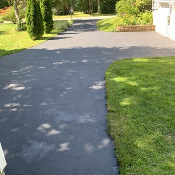 Accurate Sealcoating - a paved driveway in a residential area - General Contractors Near Me - Windham, New Hampshire