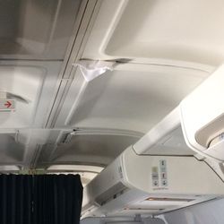 Aer Lingus - Pillowcase stuffed into the ceiling of the plane.