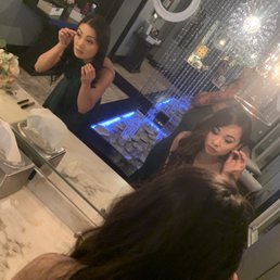 Ladies in the beautiful bathroom getting ready Ladies in the beautiful bathroom getting ready