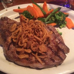 Rudy's Steakhouse - This was the New Year's Eve special, 16 oz ribeye, sub starch for extra veggies! Perfectly cooked and delicious!!