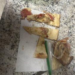Luigi's Italian Cafe - One slice halved straight from the box
