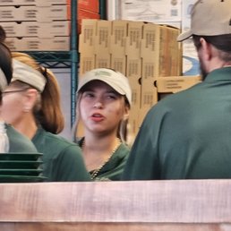Bob is the one in the tan ball cap, speaking with Yariza , Even in this photo, she's angry.