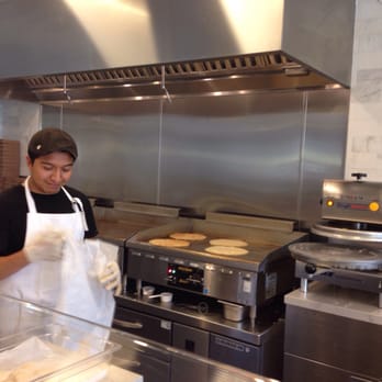 Piadina - Santiago pressing fresh flat dough out of bread - Italian Near Me - Tustin, California