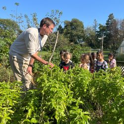 Waldorf School of Garden City - Young students in gardening class.
