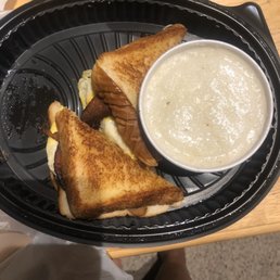 Bacon, egg, and cheese melt with a side of grits Bacon, egg, and cheese melt with a side of grits