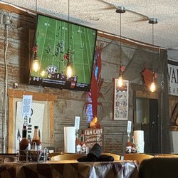 Wahoo's Seafood - They have football on TV on Saturdays. College games.