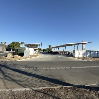 Tesla Supercharger - Firebaugh - Wider shot of all chargers. - EV Charging Stations Near Me - Firebaugh, California