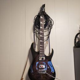 Ibanez Gio with bound, roasted maple 24 fret neck, mahogany body, figured top, sharktooth inlays and trem for 239. Better deals at GC!