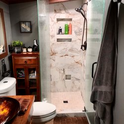 Able & Ready Construction - post renovation, glass enclosure, lights, new flooring.