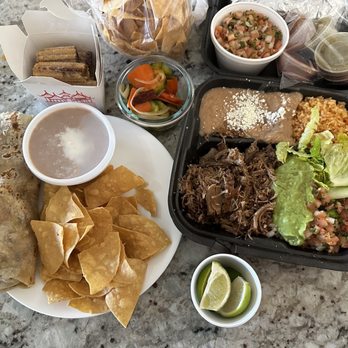 Taco Man Grill - Chicken burrito , beans side, Carnitas plate, chips and salsa, mini churros with chocolate sauce. - Mexican Near Me - Henderson, Nevada